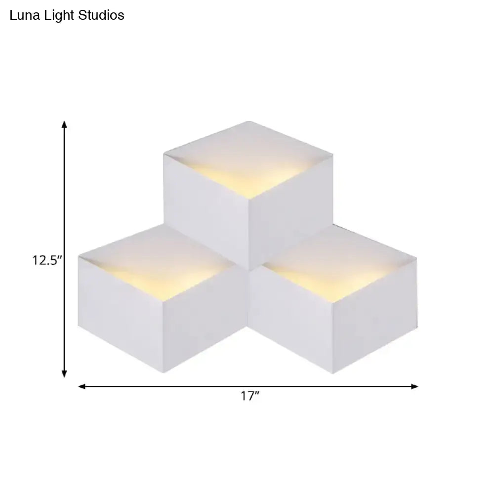 Minimalist white metallic geometric wall mount light with warm yellow glow designed as a corridor wall lamp