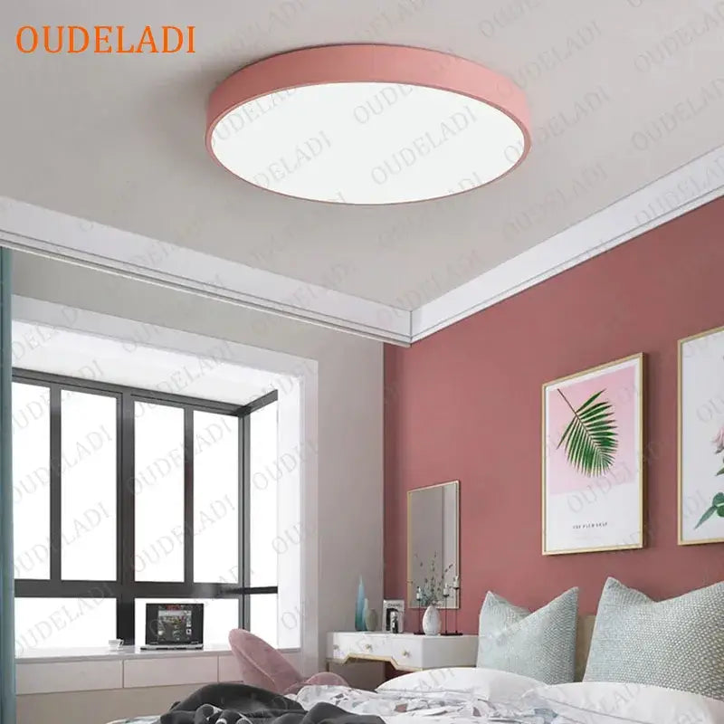 Pink circular ceiling light fixture featuring decorbites colorful round led design for minimalist bedroom decor