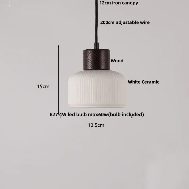 Minimalist white ceramic pendant light with ribbed texture and dark wood accent for dining room home decor decorbites ceramic led