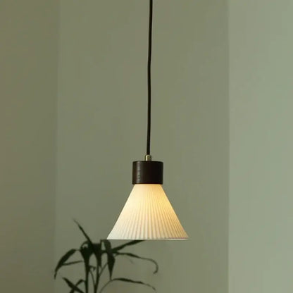 Minimalist white pleated glass pendant light with dark wood finish for dining room home decor by decorbites ceramic led