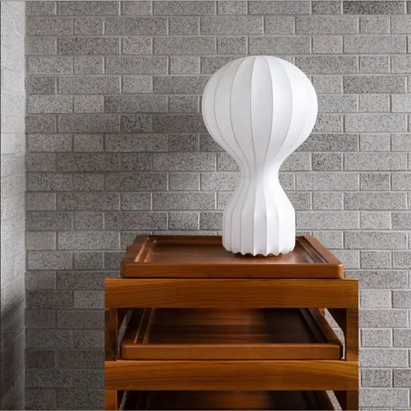 Minimalist white ribbed cocoon silk table lamp with sleek modern design for bedroom decorbites gatto cocoon silk