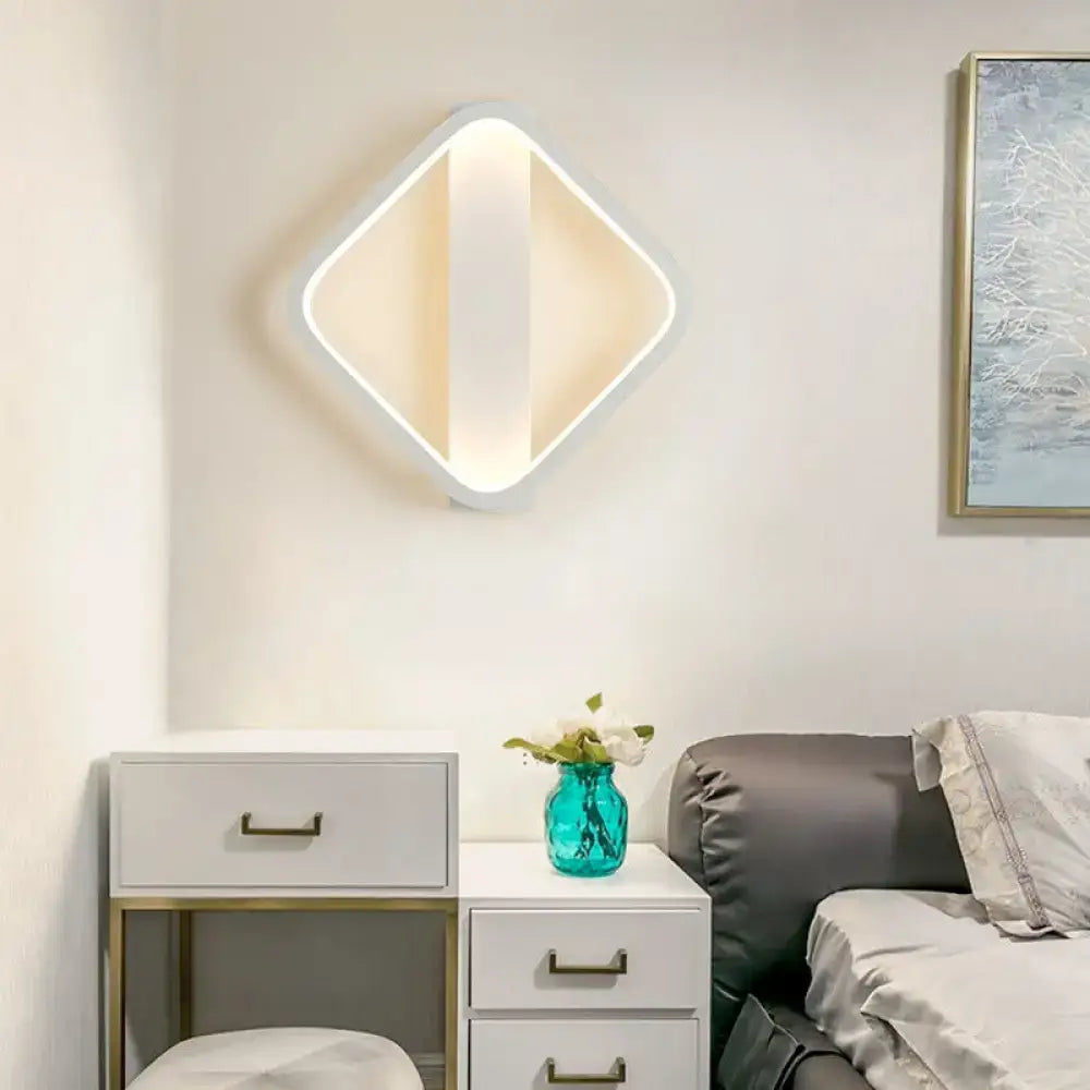 Modern white led wall sconce with diamond-shaped round square design and warm diffused lighting for bedroom use
