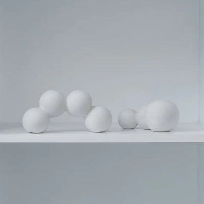 Minimalist white speckled geometric ceramic handicraft sphere sculpture with matte textured finish for living room decor