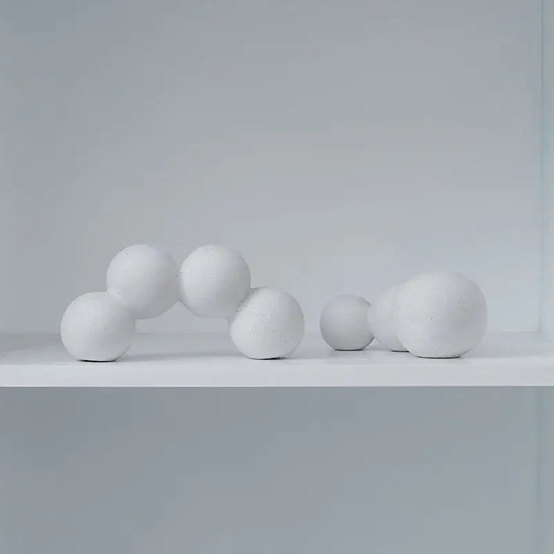 Minimalist white speckled geometric ceramic handicraft sphere sculpture with matte textured finish for living room decor