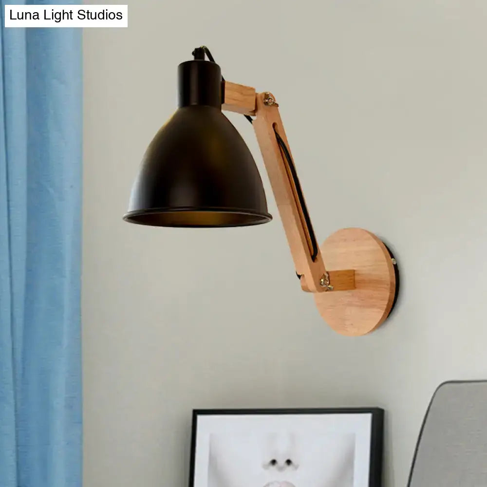Black metal swing arm wall light with wooden arm and circular base featuring a matte white black finish for bedrooms