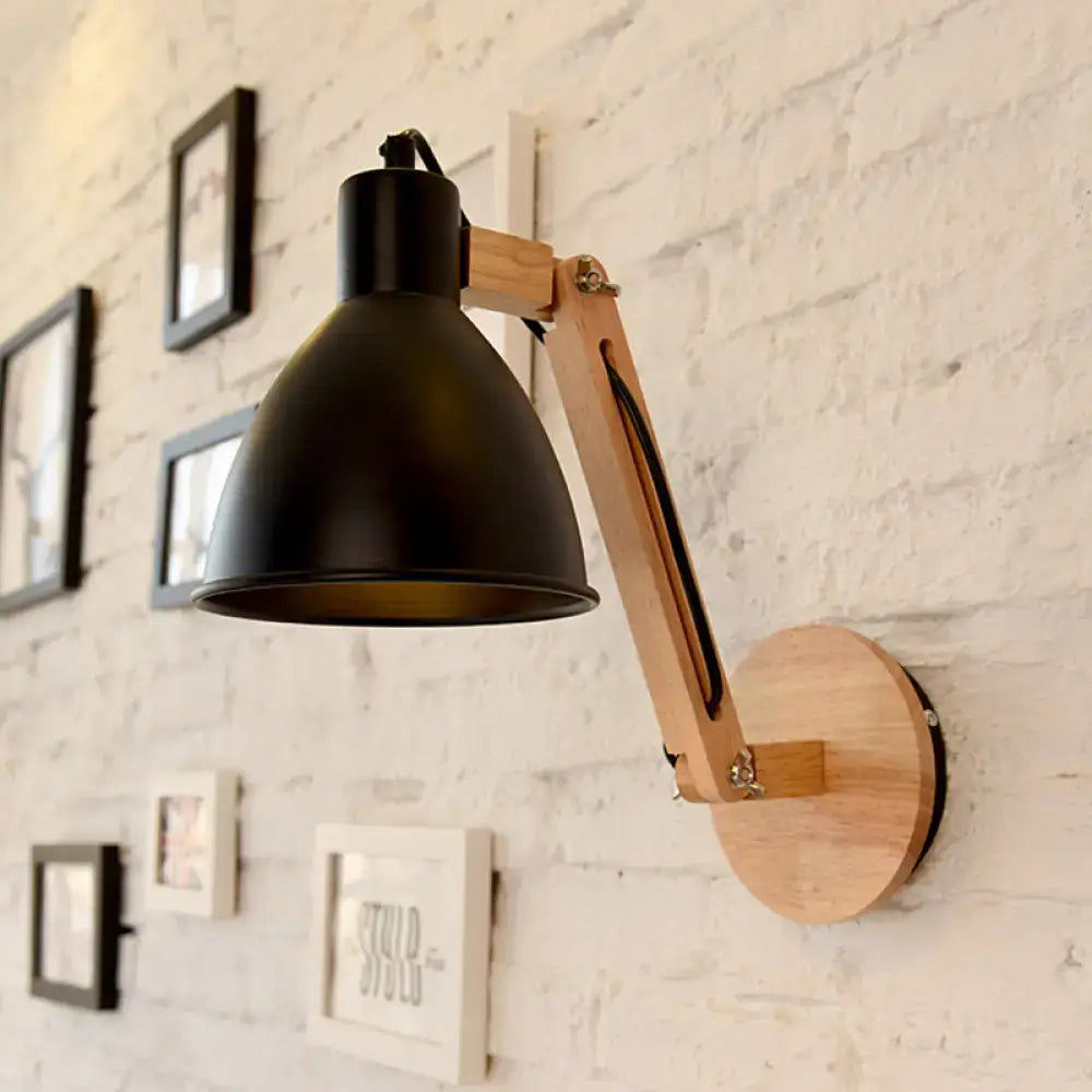 Black matte swing arm wall light with wooden articulated arm and circular base in white black finish for bedroom