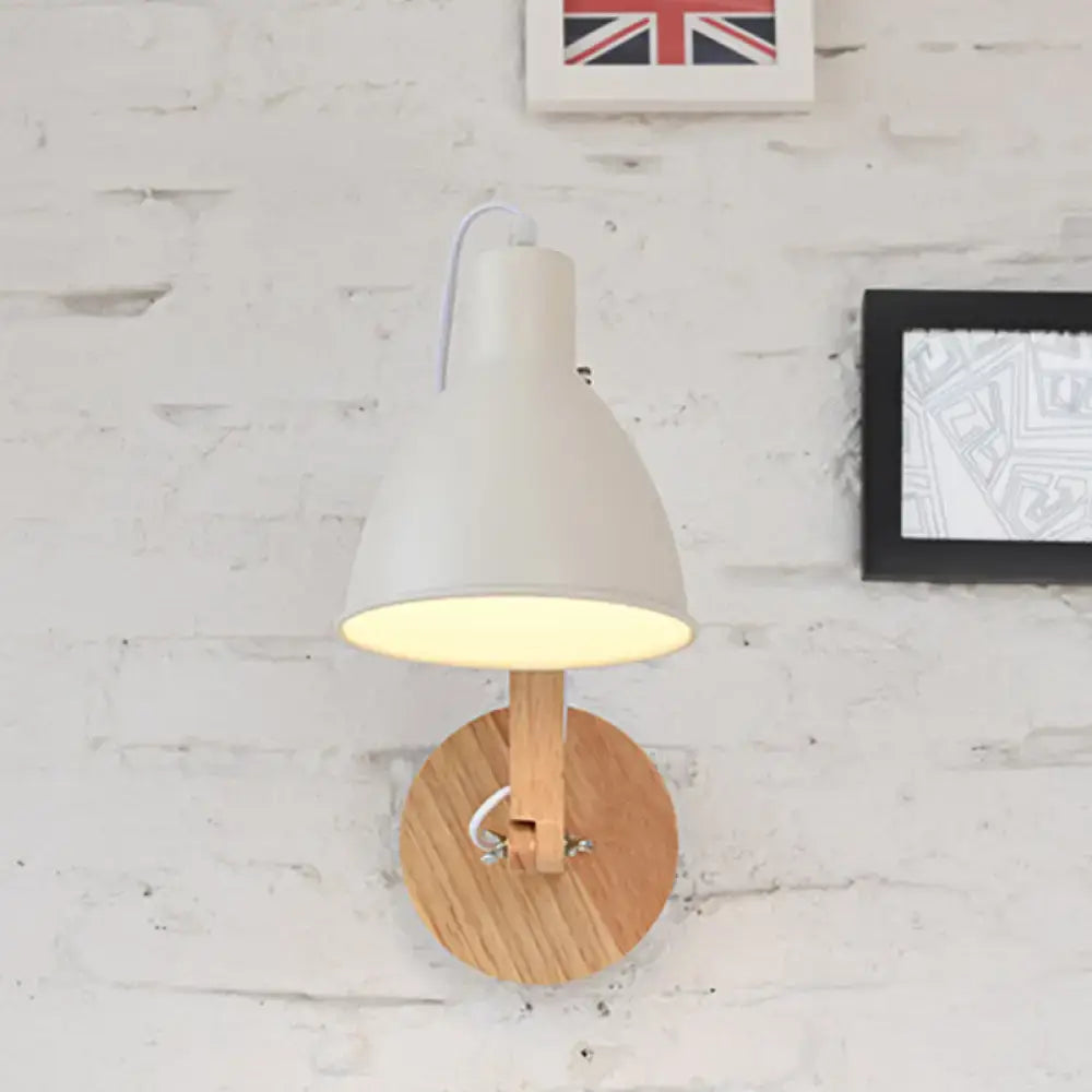 Minimalist white swing arm wall light with iron dome, wooden base, and adjustable arm for bedroom use