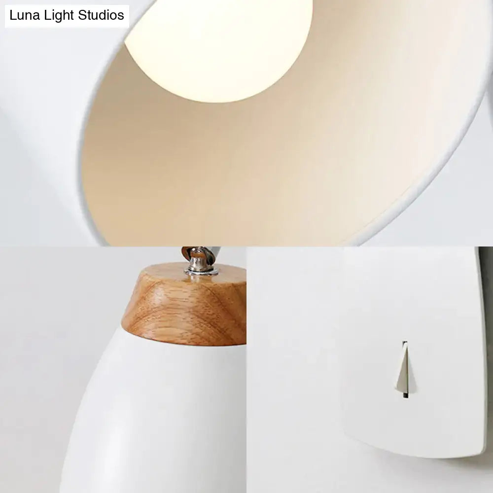 Minimalist white tapered wall light with wood accents featuring a white conical shade and natural wood toned base