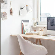 Minimalist white tapered wall light with wood accents featuring a sleek adjustable arm study desk lamp