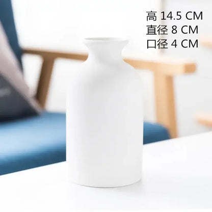 Minimalist white decorbites ceramic vase with smooth matte finish and curved silhouette for dining room decor