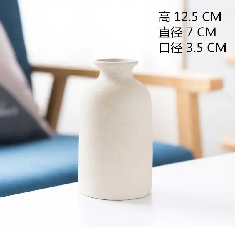 Minimalist off-white decorbites ceramic vase with speckled texture and smooth rounded contours for dining room decor