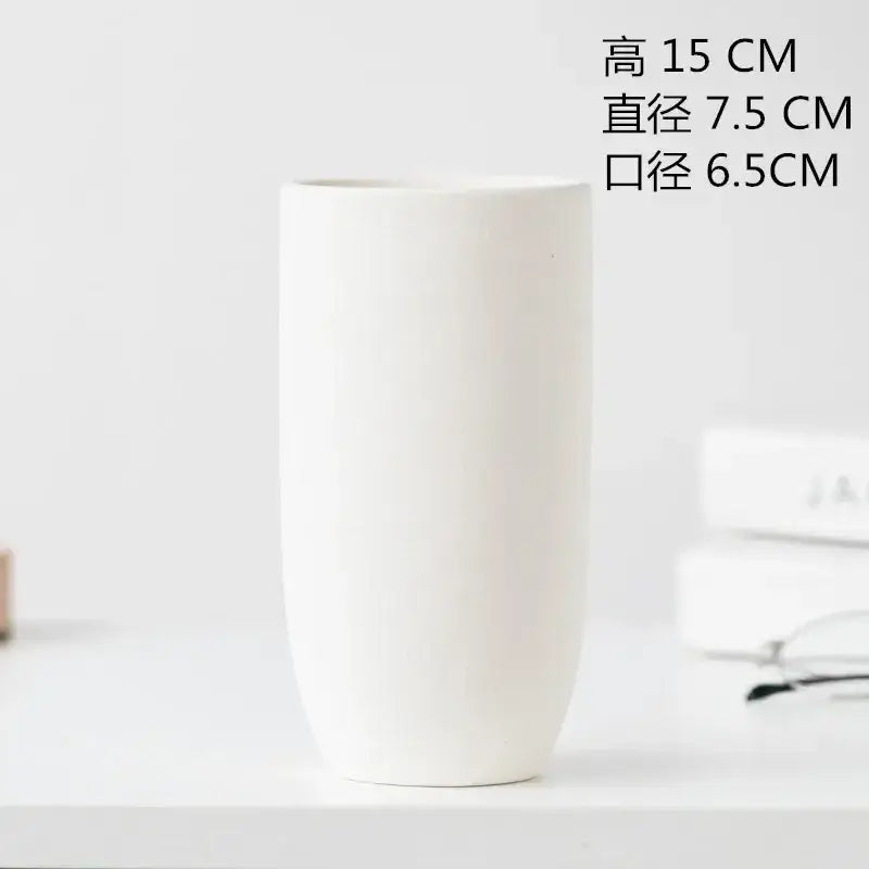 Minimalist white decorbites ceramic vase with smooth matte finish and flared rim for dining room decor