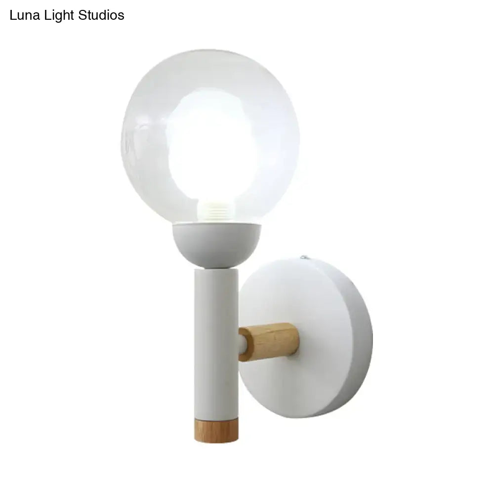 Minimalist white and wood armed wall lamp with frosted glass globe and metal body for 110v-120v bedroom use