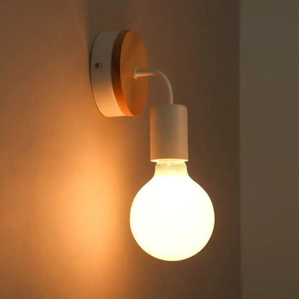 Minimalist white and wood wall sconce with a warm-toned frosted glass bulb and direct wired electric design