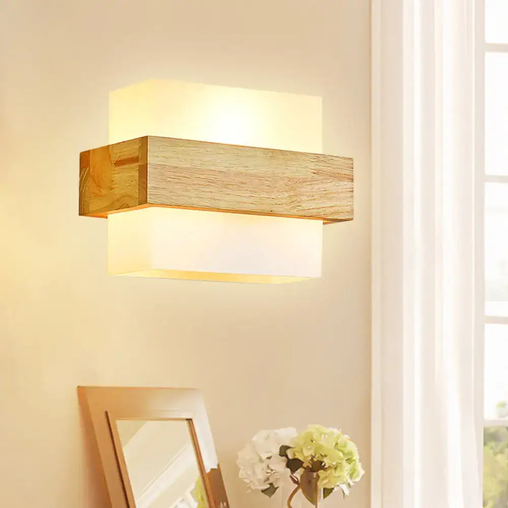 Minimalist wood and opal glass wall sconce with warm diffused glow for bedroom wall light illumination