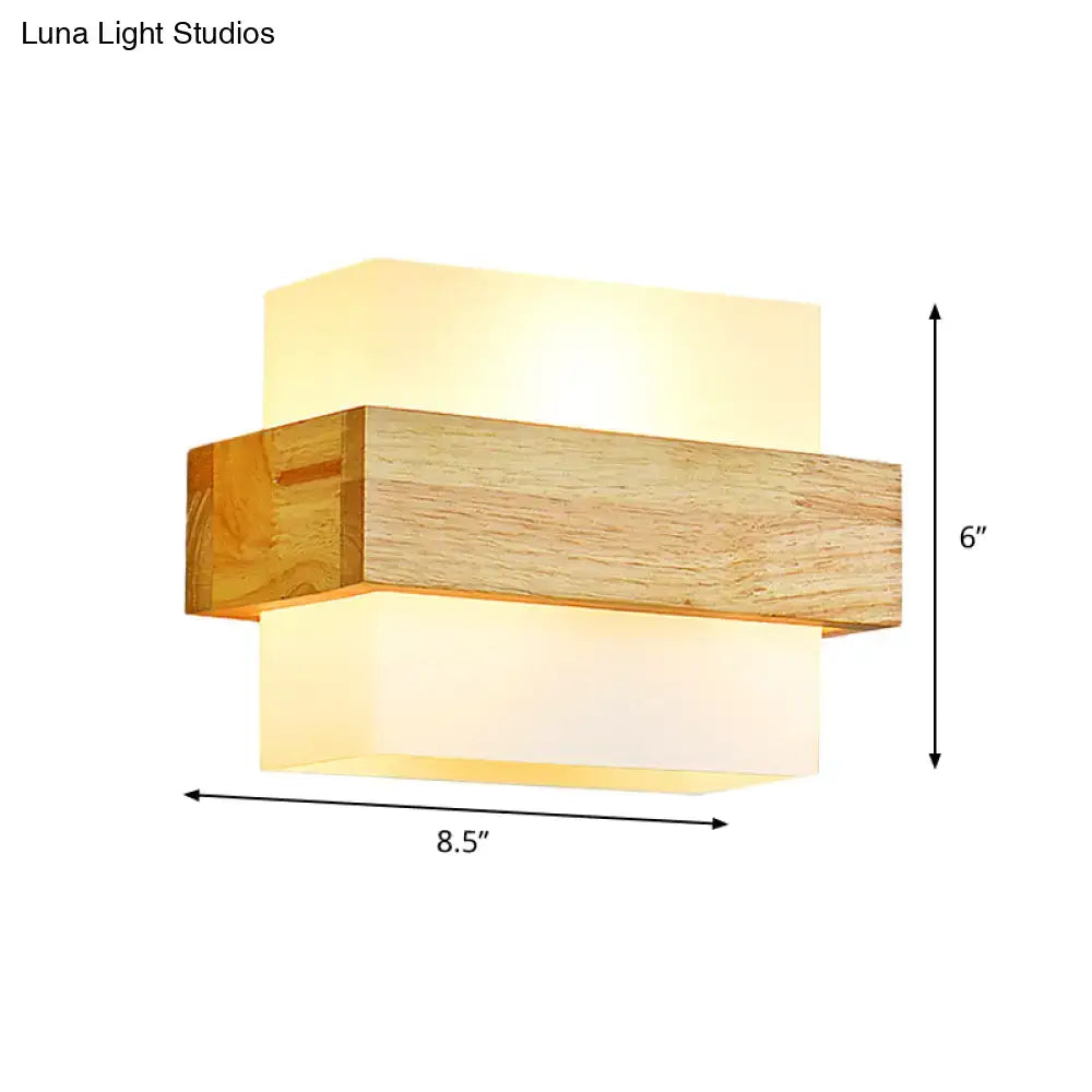 Minimalist wood and opal glass wall sconce with warm layered design for bedroom wall light illumination