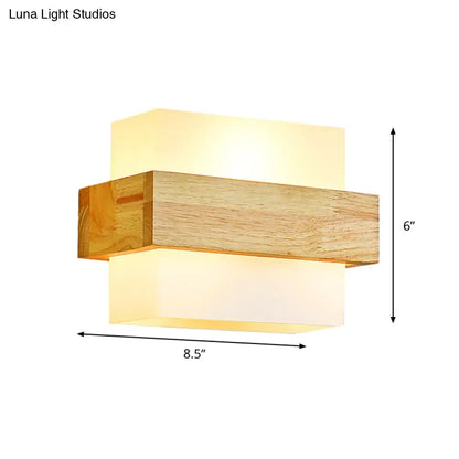 Minimalist wood and opal glass wall sconce with warm layered design for bedroom wall light illumination