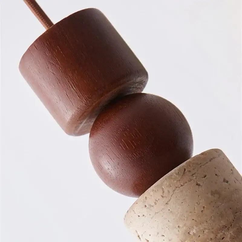 Minimalist wood and yellow travertine led pendant light with dark brown wooden beads and light beige cork bead decorbites led yellow