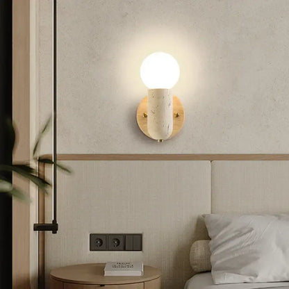 Minimalist wood and yellow travertine led wall sconce with frosted glass globe and ceramic stem for bedroom decorbites led wall lighting