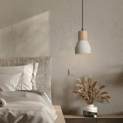 Minimalist wood and white ceramic pendant lamp with matte finish and black cord for bedroom decorbites cement concrete bedside