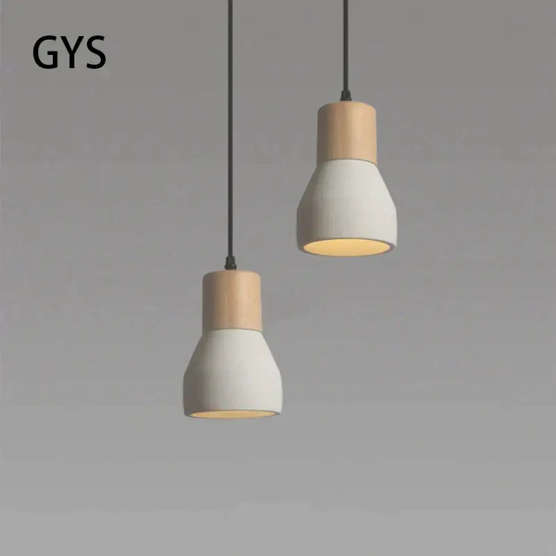 Minimalist wood and white ceramic pendant lamp with two-tone design suspended by black cords for bedroom decorbites cement concrete