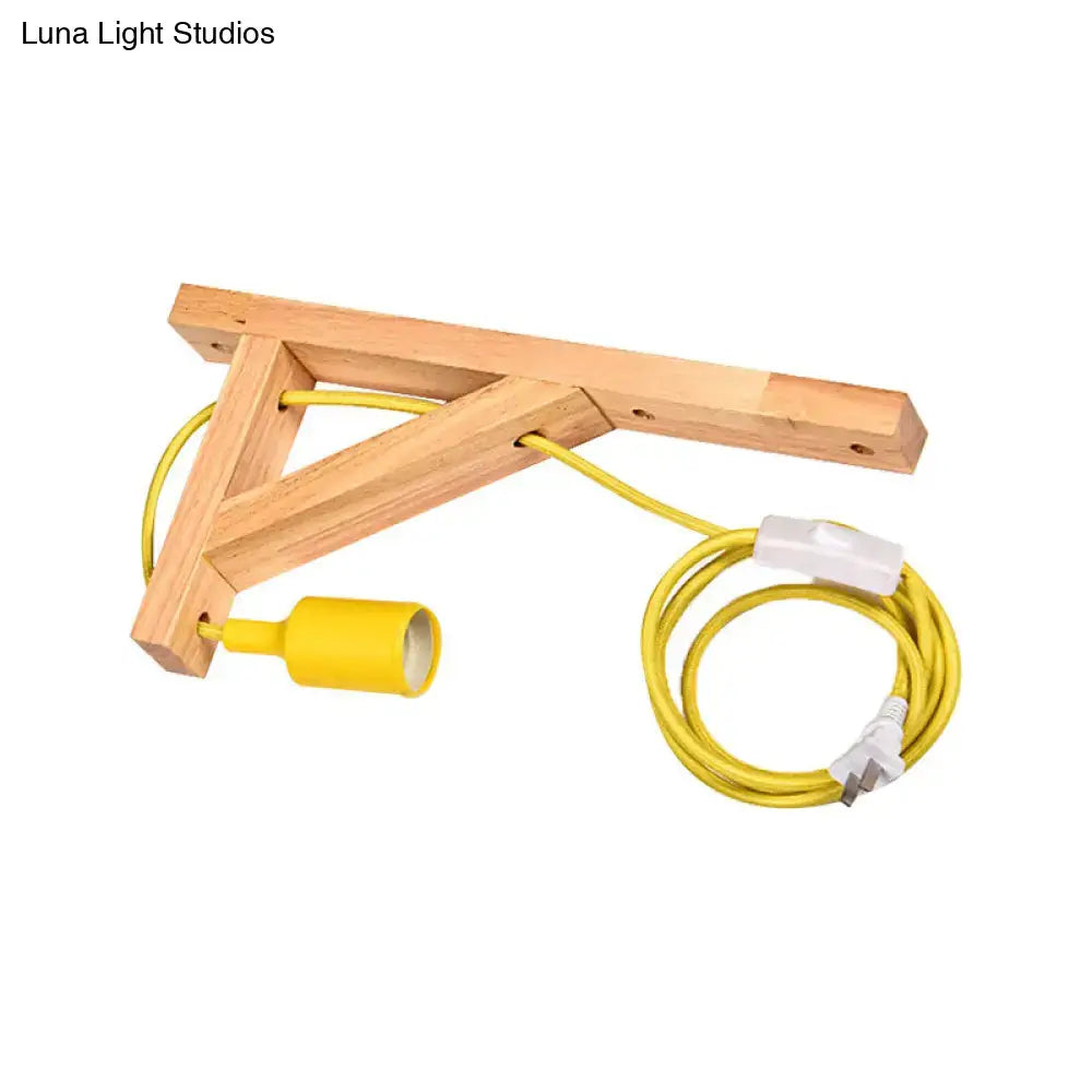 Minimalist yellow corded wall sconce with natural wood bracket and medium base wall lamp for bedroom use