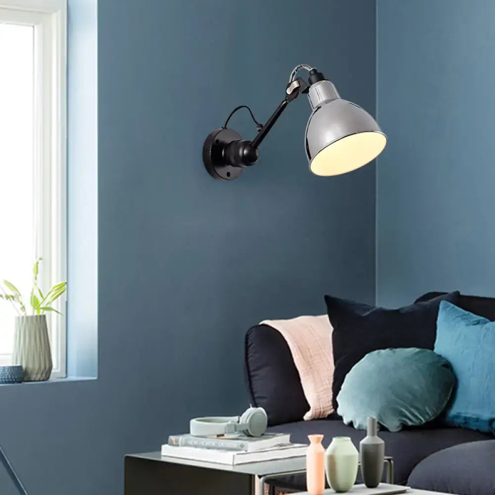 Minimalist living room wall mounted lamp with matte silver metal shade and black articulated arm in industrial style