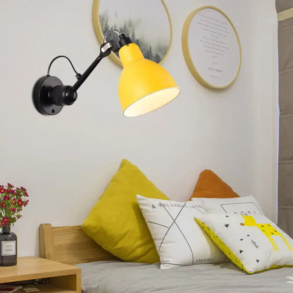 Minimalist yellow metal wall mounted lamp with black articulated arm and base for living room wall lamp use