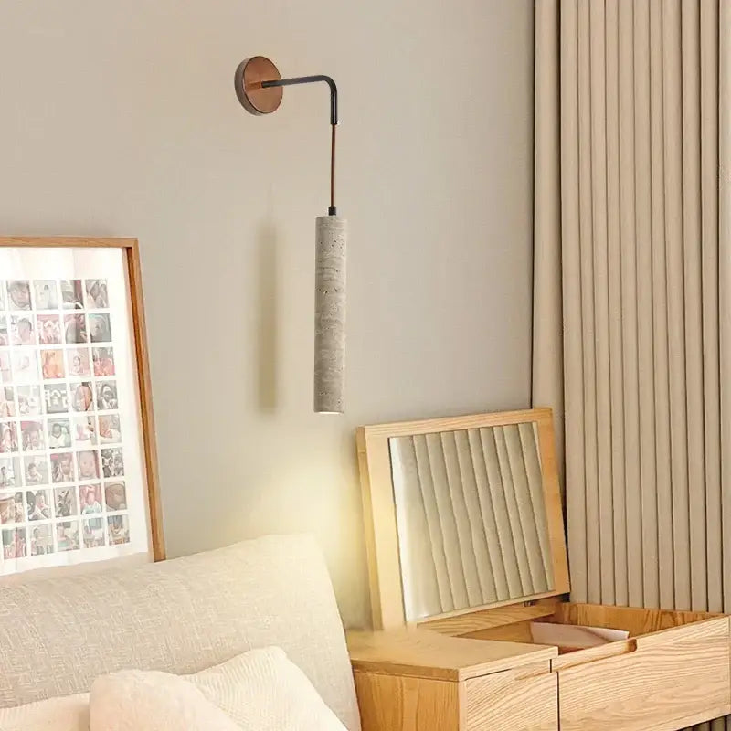 Minimalist yellow travertine adjustable led wall sconce with curved black metal arm and cylindrical concrete shade decorbites adjustable led wall
