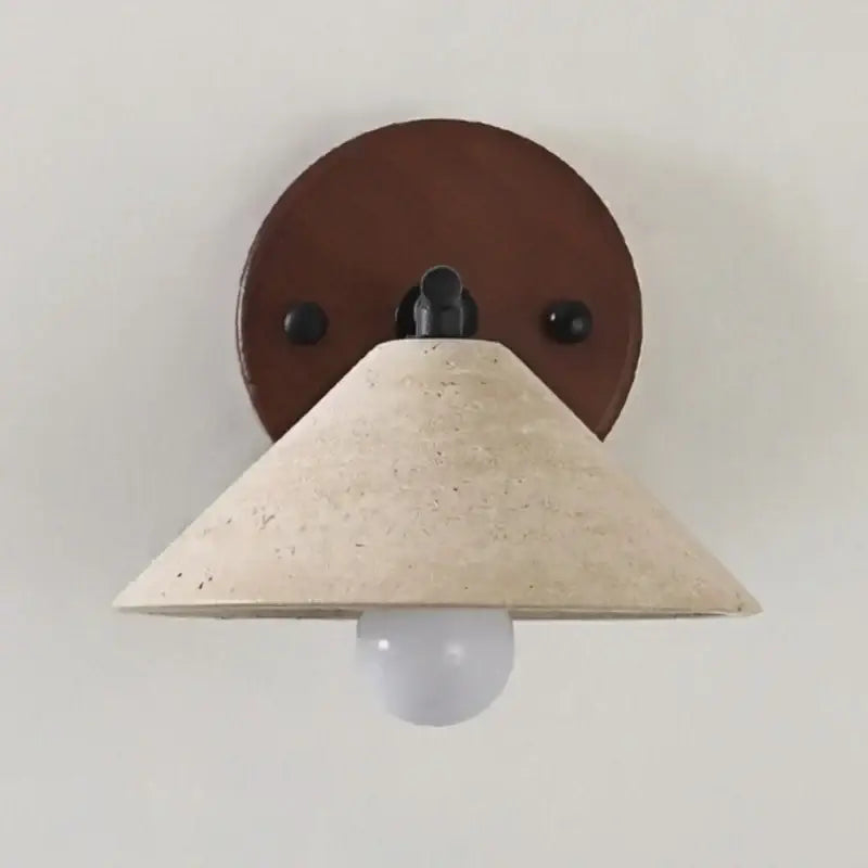 Beige concrete cone wall light with brown leather backplate and black metal hardware for minimalist yellow travertine decorbites led yellow lighting