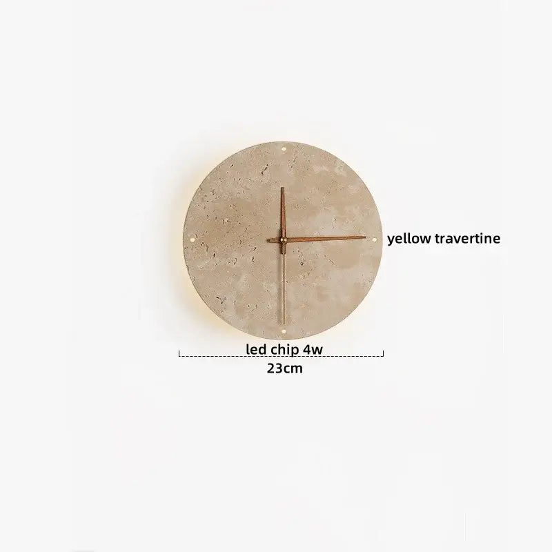 Circular wall clock with textured yellow travertine face and minimalist bronze hands complements decorbites led wall light