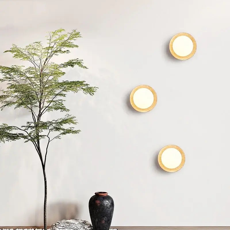 Three circular wall lights with warm glow and light wood frames decorbites led wall light for minimalist bedroom decor