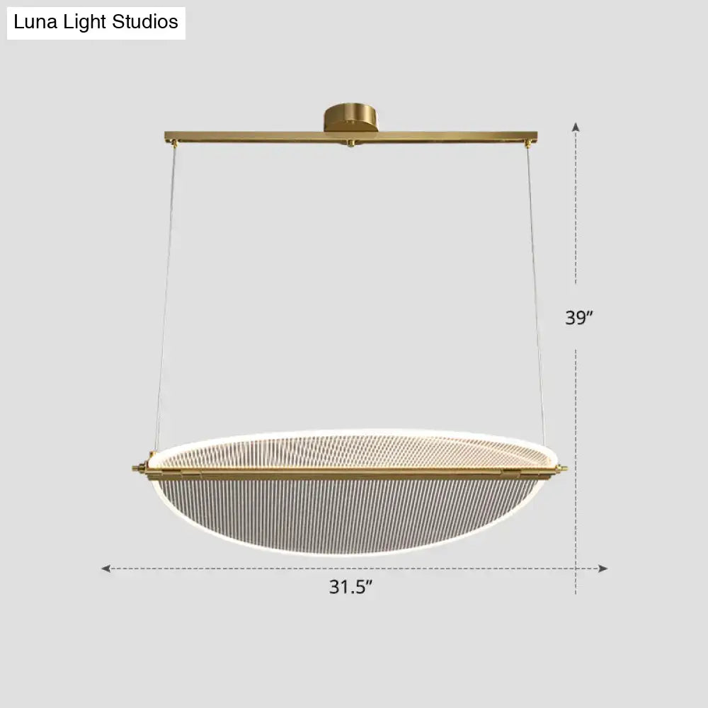 Modern gold-toned pendant light with oval mesh diffuser for minimalistic acrylic dining folding island light by DecorBites