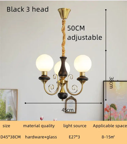 Black and brass three-head spherical glass globe style led chandelier for dining room cream style decorbites cream style