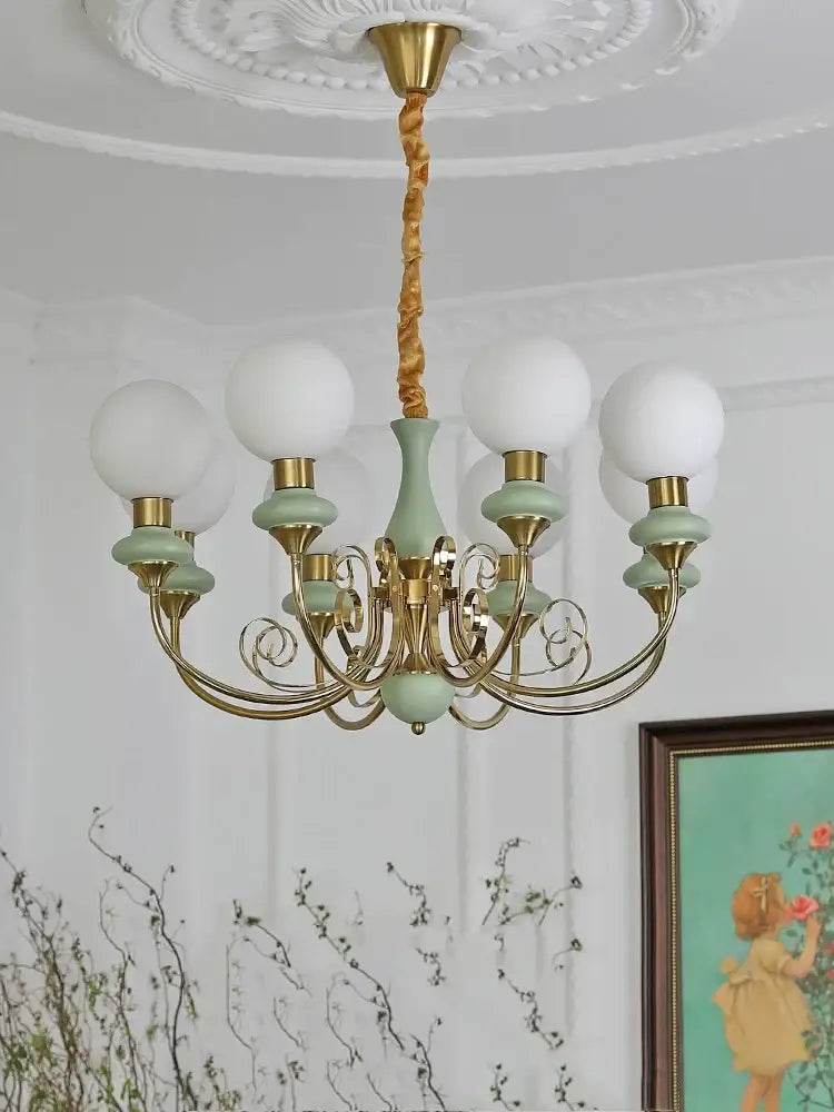 Delicate mint and gold cream style led chandelier with six frosted glass globes for dining room decorbites cream style