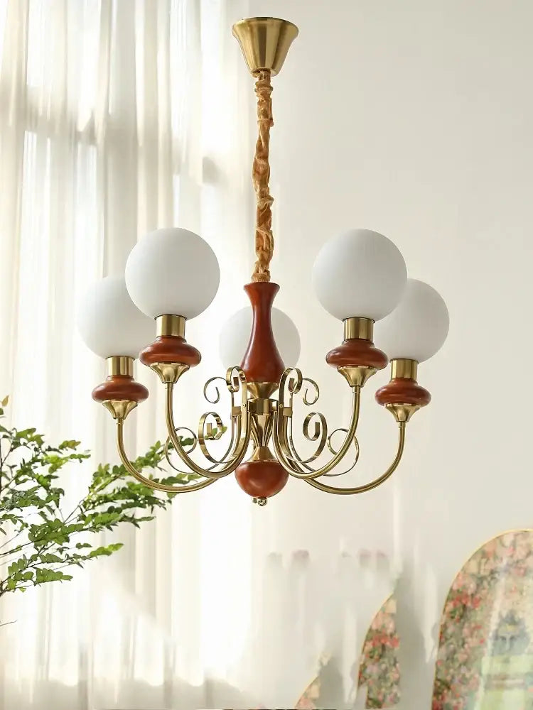Vintage-style mint and gold cream style led chandelier with brass finish and terracotta accents for dining room decorbites cream style