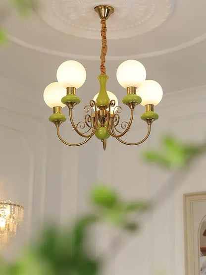 Vintage-style mint and gold cream style led chandelier with brass and ceramic accents for dining room decorbites cream style