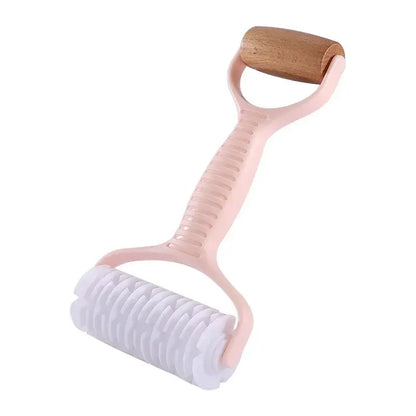 Pink plastic handle dough roller rolling pin with wooden grip and white textured roller head for decorbites grid knife use