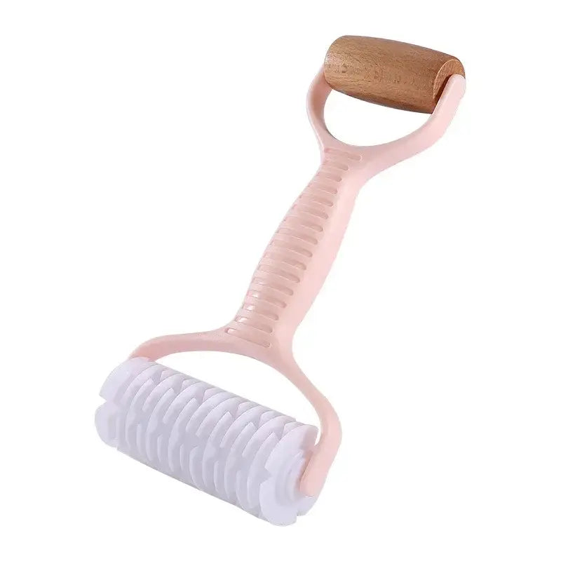Pink plastic handle dough roller rolling pin with wooden grip and white textured roller head for decorbites grid knife use