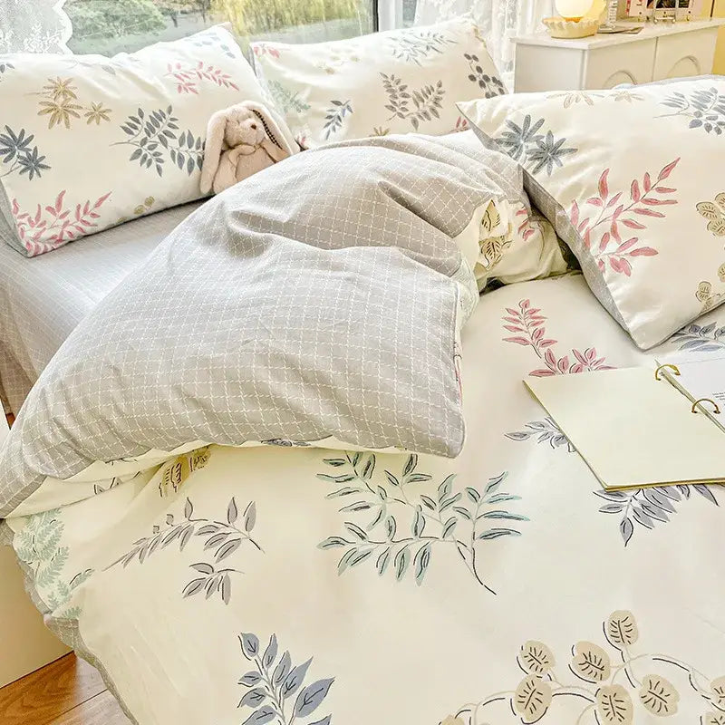 Cream-colored duvet cover with delicate leaf and floral print cotton pattern in gray pink and olive green for bedding set