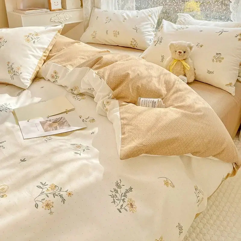Cream-colored mint and cream floral print cotton bedding set with delicate yellow and green blossoms on soft fabric