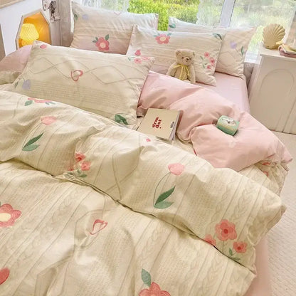 Pastel pink and cream floral print cotton bedding set with embroidered heart motifs for bedroom duvet cover use
