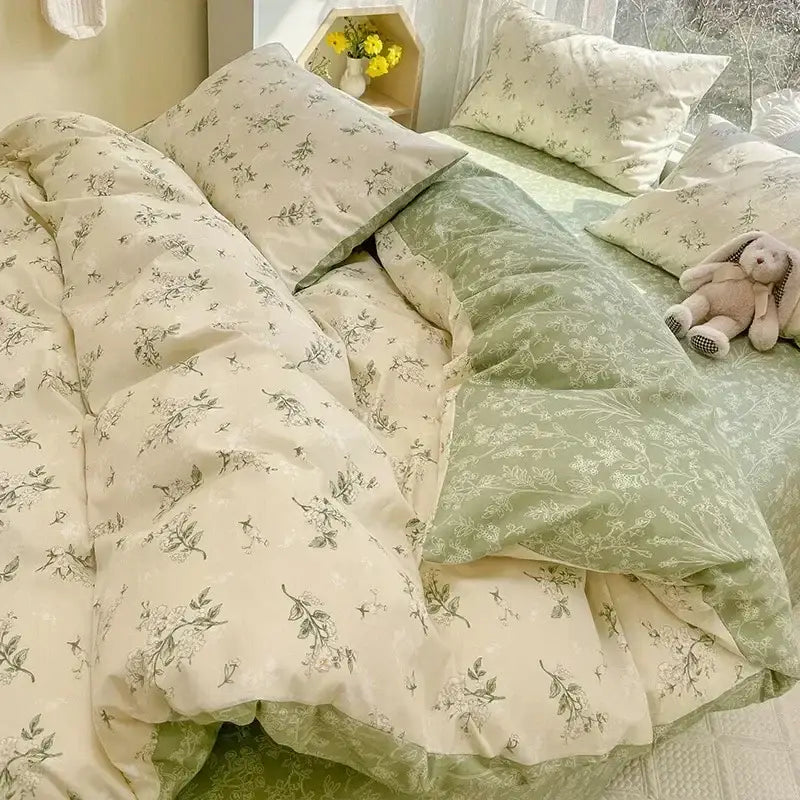 Cream-colored and sage green floral print cotton bedding set with delicate botanical prints for bedroom use