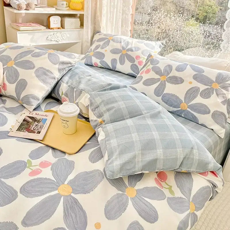 Blue and white floral print cotton bedding set with soft textured fabric in a mint and cream bedroom duvet cover