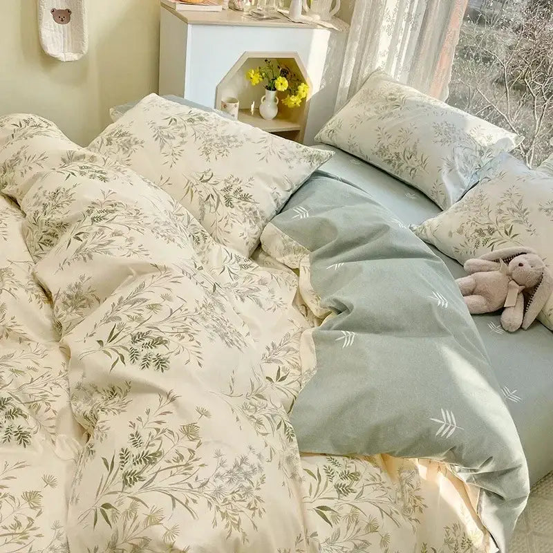 Soft cream duvet set with delicate green botanical prints and sage green pillowcase in floral print cotton bedding set