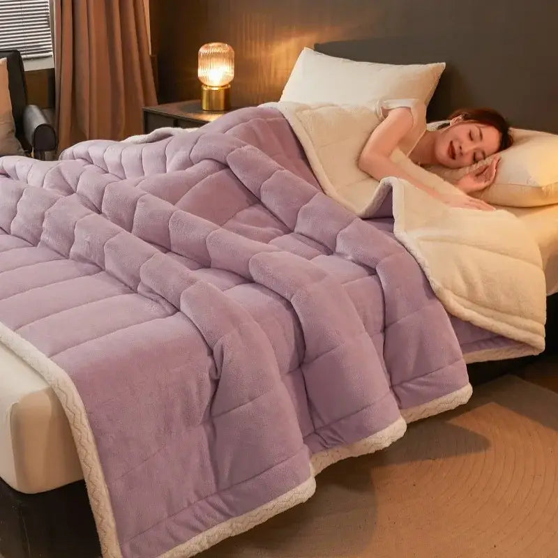 A plush lavender mint and cream coral fleece winter blanket with cream-colored fleece trim from decorbites cozy