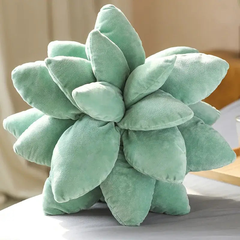 A plush mint green succulent cactus pillow with velvety fabric and rounded leaf segments for living room decor