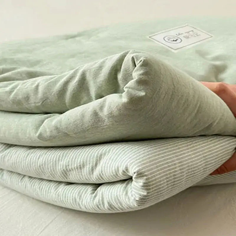 Mint green cotton summer cooling blanket backside showing delicate white stripes and subtle textured weave decorbites cotton summer