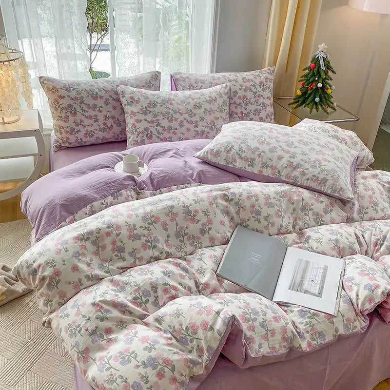 Mint green and cream cotton quilt set with lavender and pink floral pattern featuring cartoon heart plant design