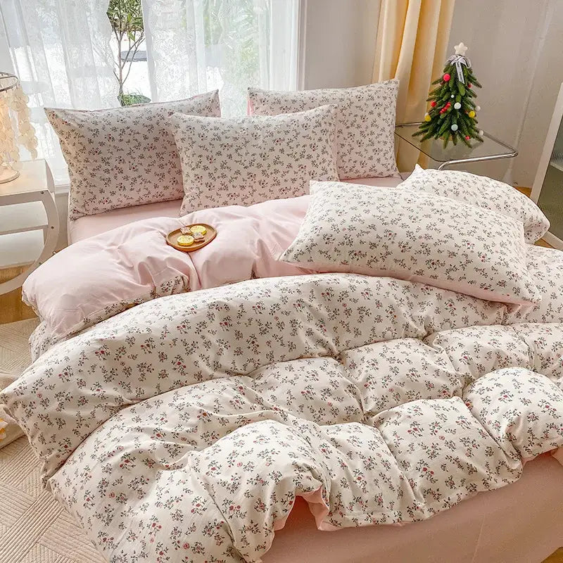 Pink floral comforter set featuring a delicate all-over pattern of small blossoms in soft pastel hues for bedroom bedding with cartoon heart plant design